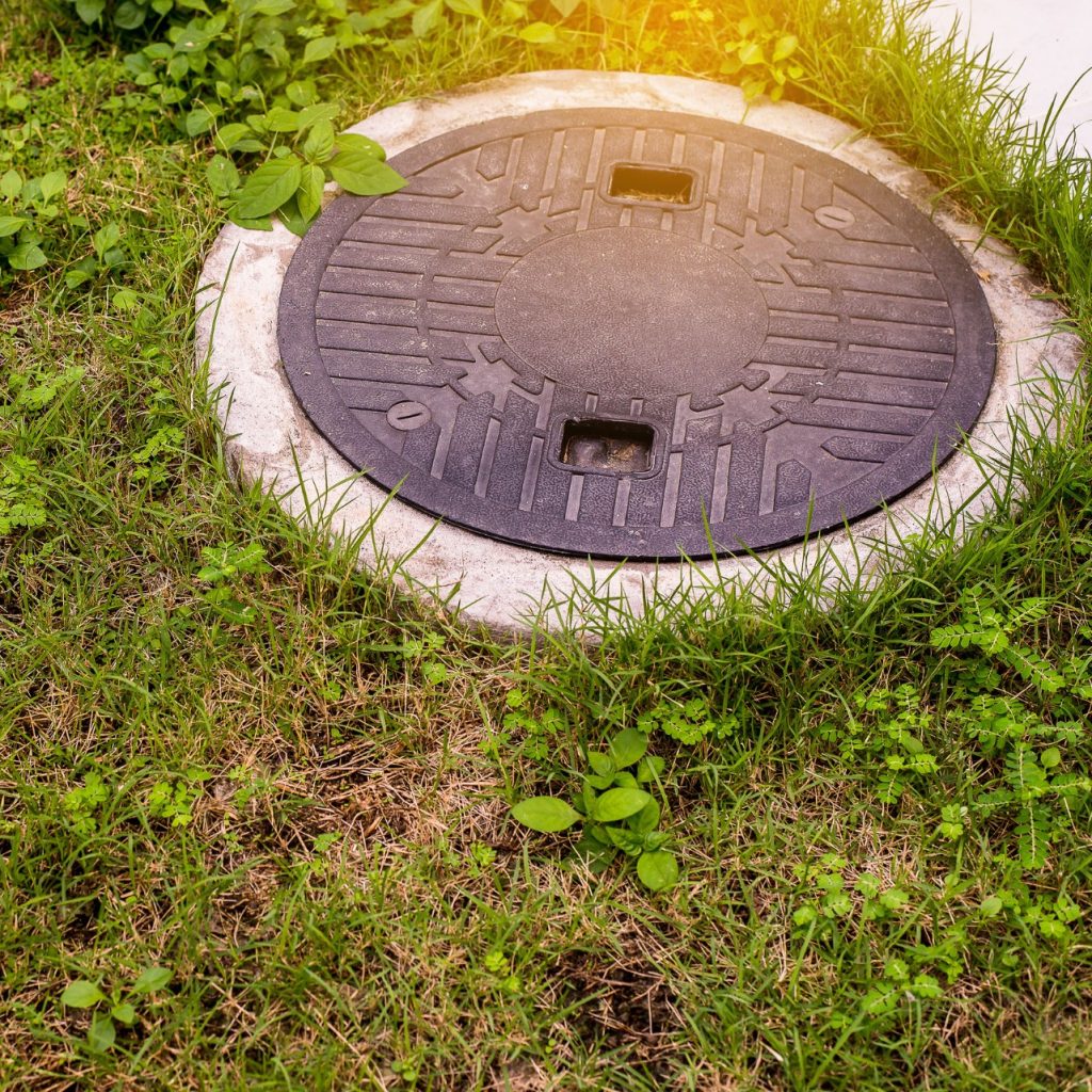 septic system surrounded by grass