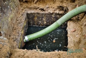A Picture of a Hose That is Draining a Septic Tank