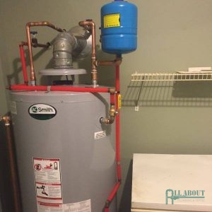 A Picture of a Water Heater in a Laundry Room